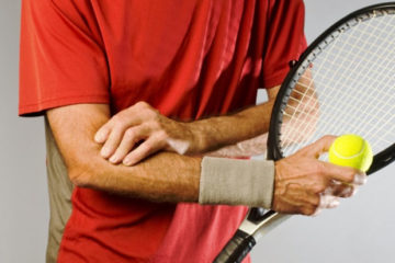 male tennis player with tennis elbow